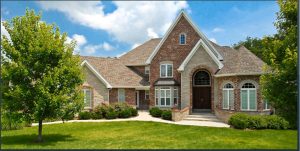 Beautiful house with green landscaping.