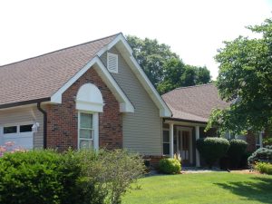 Charming house with landscaped front yard.