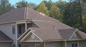 House roof with trees in background
