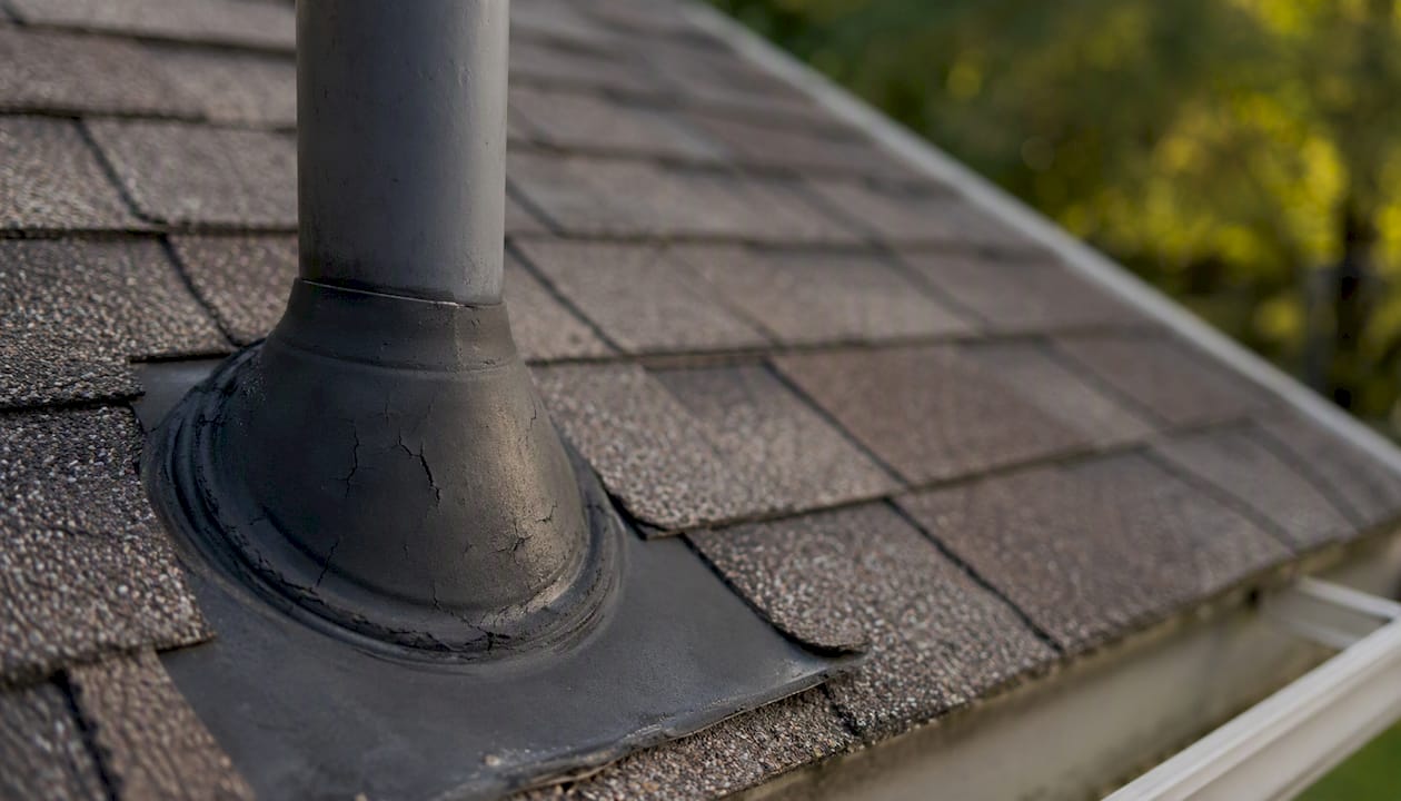 Close-up of vent pipe boot flashing on roof pipe