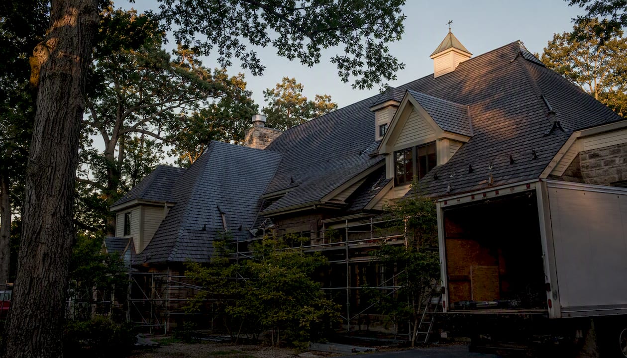 Steep complex roof with limited access and trees