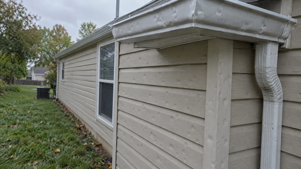 Hail dents on gutter and siding